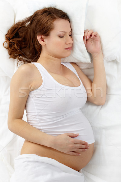 Profundo sueno foto hermosa mujer embarazada dormir Foto stock © pressmaster