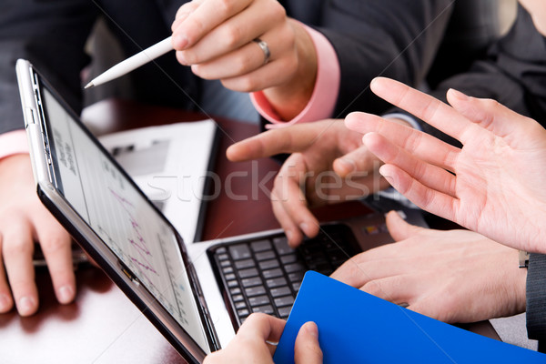 Csapatmunka fotó emberi kezek mutat monitor Stock fotó © pressmaster