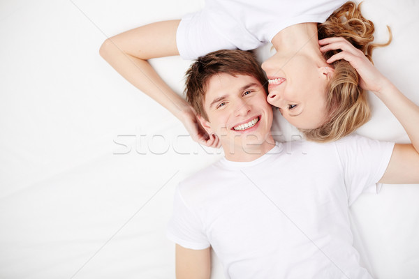 Affection deux heureux jeunes dates lit [[stock_photo]] © pressmaster