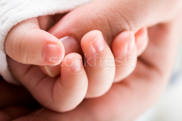 Main bébé peau clou macro Photo stock © pressmaster