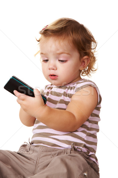 Portré aranyos kisgyerek néz mobiltelefon kezek Stock fotó © pressmaster