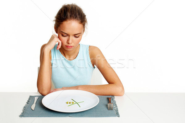 Pequeno comida retrato triste menina olhando Foto stock © pressmaster