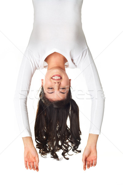 Ahogy akrobata nyugodt lány mosolyog kamera Stock fotó © pressmaster