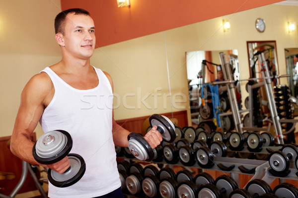 Weightlifting in gym Stock photo © pressmaster