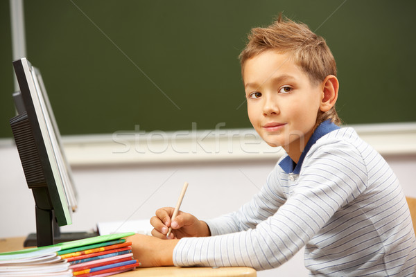 Schoolboy at lesson Stock photo © pressmaster