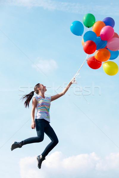 Care zboară imagine colorat baloane femeie Imagine de stoc © pressmaster