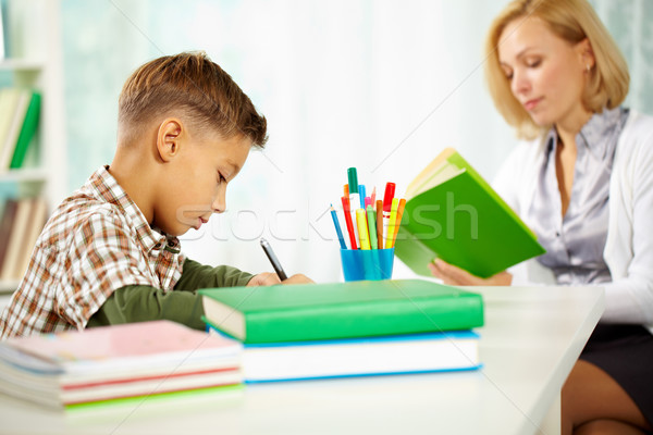 Escrito trabalhar retrato diligente menino escrita Foto stock © pressmaster