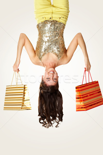 Boldog vásárló fejjel lefelé kilátás fiatal lány nő Stock fotó © pressmaster