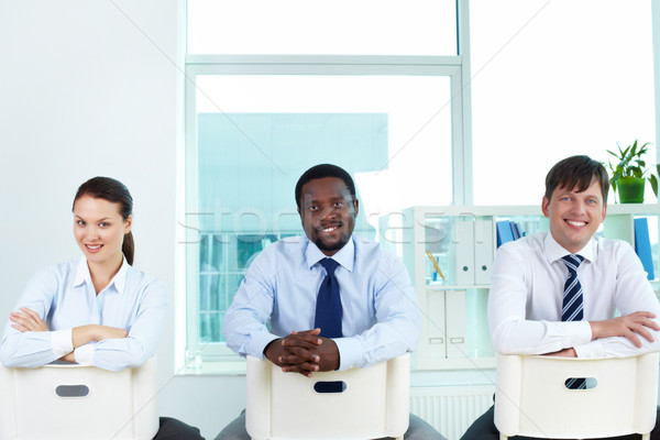 Réussi groupe portrait équipe commerciale séance chaises [[stock_photo]] © pressmaster