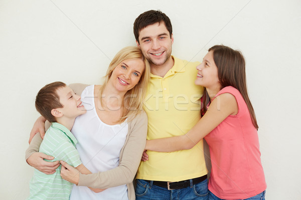 Felicidade retrato afetuoso família quatro posando Foto stock © pressmaster