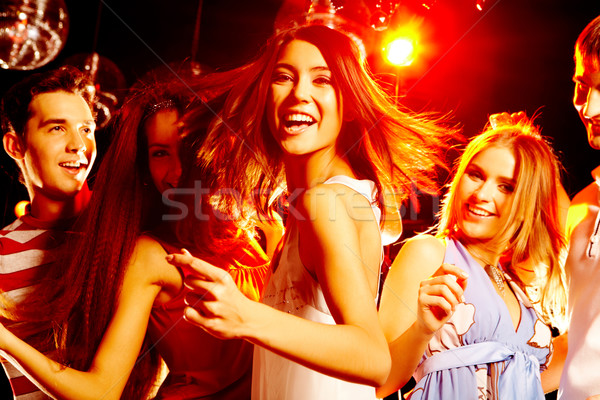 танцы вечеринка портрет смеясь девушки белое платье Сток-фото © pressmaster