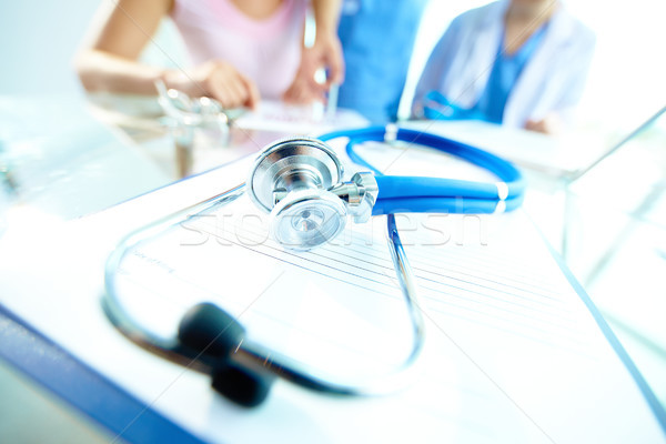 Stethoscope on workplace Stock photo © pressmaster