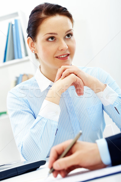 Atento feminino inteligente empresária escuta colega Foto stock © pressmaster