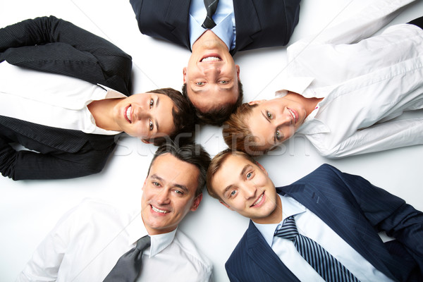 üzlet szövetség öt üzletemberek padló néz Stock fotó © pressmaster