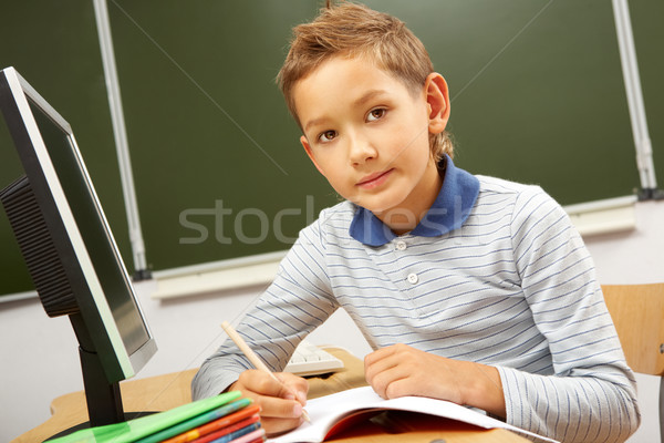 Schoolboy at the desk Stock photo © pressmaster