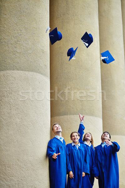 Joc grup inteligent studenţi absolvire Imagine de stoc © pressmaster
