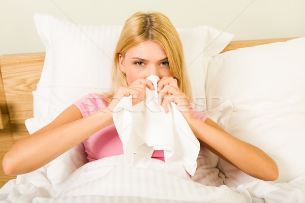 Betegség fotó beteg nő ül ágy Stock fotó © pressmaster