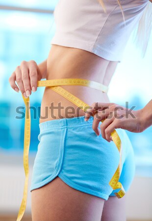 Delgado cintura primer plano encajar femenino cinta métrica Foto stock © pressmaster