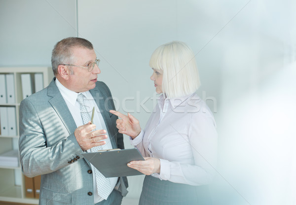 зрелый бизнесмен коллега глядя один другой Сток-фото © pressmaster