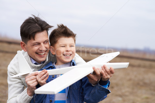 Stock fotó: Játszik · kívül · fotó · vidám · fiú · játék · repülőgép
