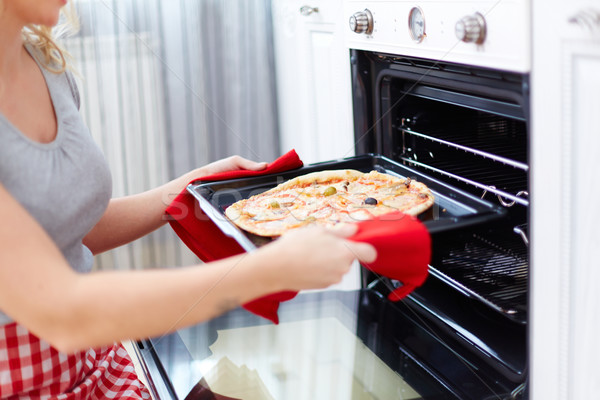 Cooking pizza Stock photo © pressmaster