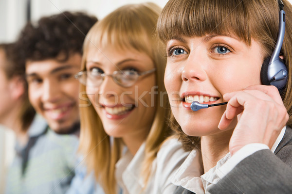 Vriendelijk dienst glimlachend exploitant drie Stockfoto © pressmaster