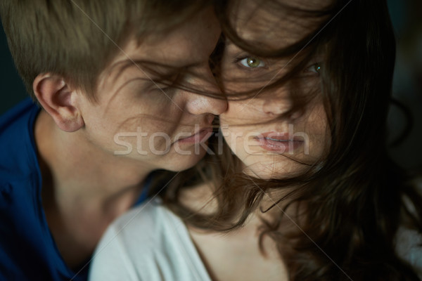 Szeretet szenvedély fiatal nő néz kamera kedvesem Stock fotó © pressmaster