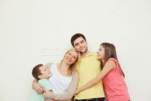 Alegre cariñoso familia cuatro posando Foto stock © pressmaster