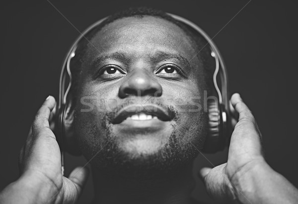 восхитительный парень наушники прослушивании любимый музыку Сток-фото © pressmaster