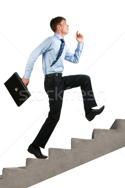 Prestatie afbeelding gelukkig zakenman lopen naar boven Stockfoto © pressmaster