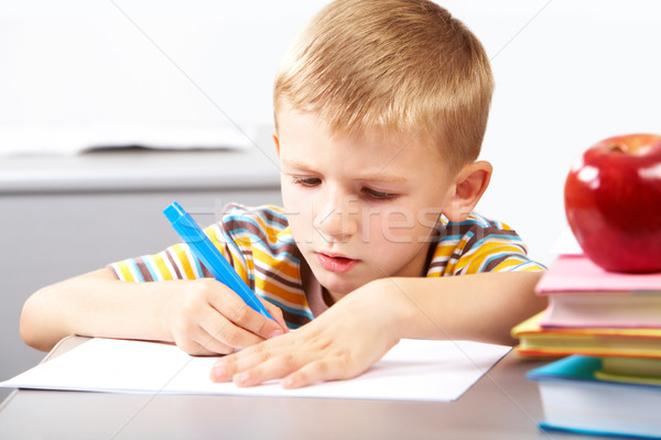 Lição retrato sério menino crayon Foto stock © pressmaster