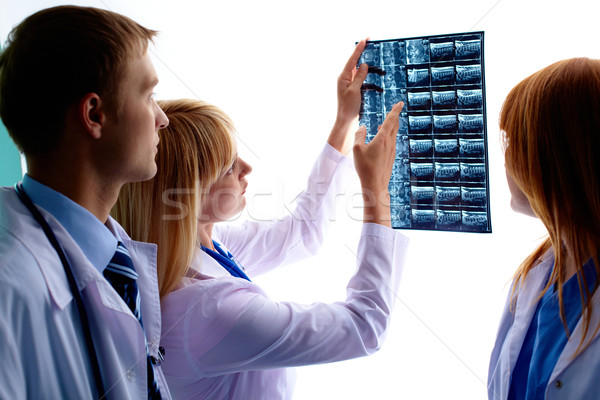 Looking at x-ray photograph Stock photo © pressmaster