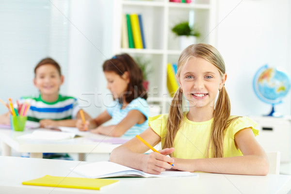 Schoolchild at desk Stock photo © pressmaster