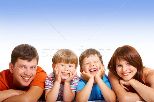 Zdjęcia stock: Zabawy · line · szczęśliwą · rodzinę · patrząc · kamery · uśmiechnięty