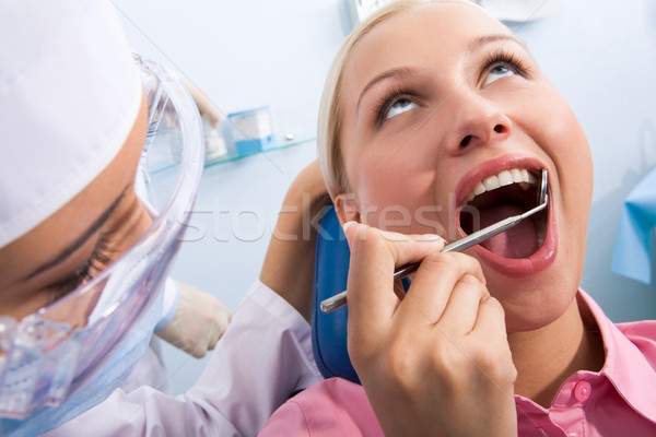 Stomatologicznych obraz młoda kobieta inspekcja ustny jama Zdjęcia stock © pressmaster