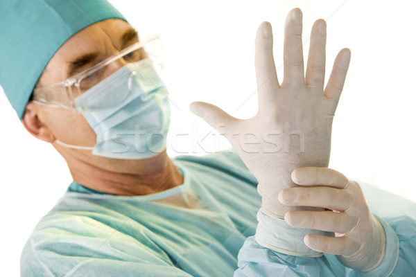 Operacja portret lekarza ubieranie się medycznych rękawice Zdjęcia stock © pressmaster