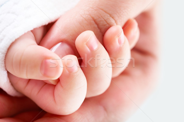 Junto primer plano femenino pulgar pequeño mano Foto stock © pressmaster