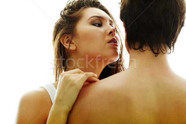 Bastante morena tocante masculino ombro olhando Foto stock © pressmaster