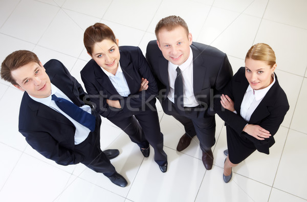 Afbeelding business team naar camera glimlacht business Stockfoto © pressmaster
