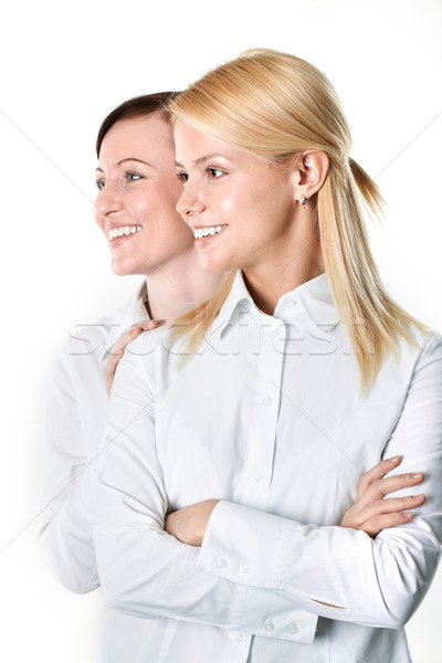 Stock photo: Two cheerful businesswomen 