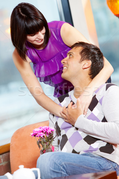 Gyengédség boldog lány átkarol jóképű férfi köteg virágok Stock fotó © pressmaster