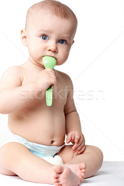 Baby with spoon Stock photo © pressmaster