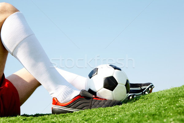 Détente horizontal image assis joueur jambe [[stock_photo]] © pressmaster