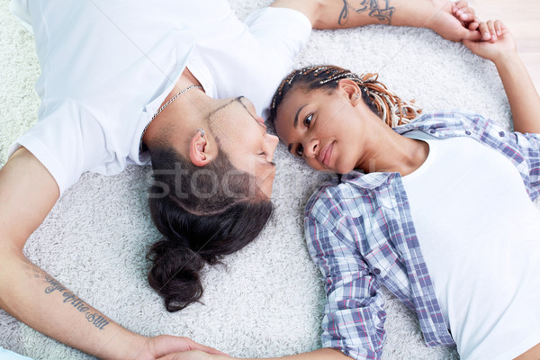 Odaadás kép fiatal fickó barátnő padló Stock fotó © pressmaster