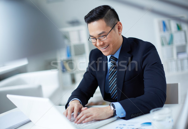 Businessman typing Stock photo © pressmaster