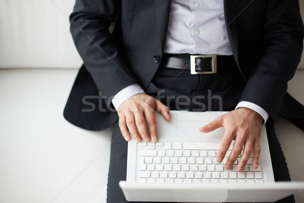 Stock fotó: üzletember · gépel · férfi · kezek · laptop · üzlet