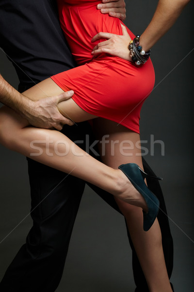 Pasión hombre pierna femenino vestido rojo moda Foto stock © pressmaster