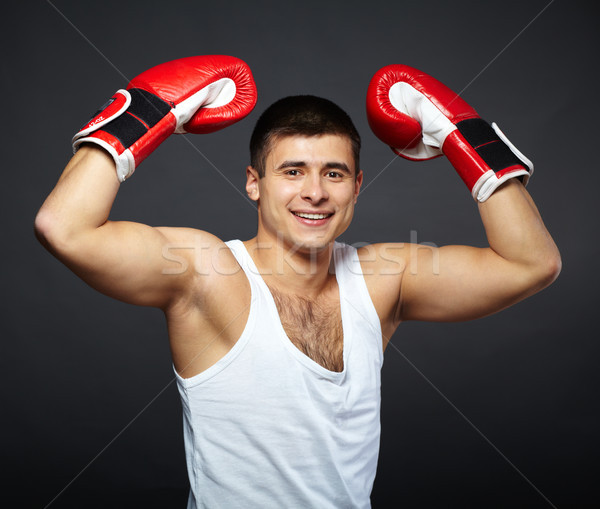 Champion portrait heureux jeune homme rouge gants de boxe [[stock_photo]] © pressmaster