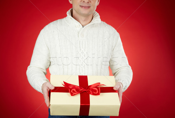 Man with Christmas gift Stock photo © pressmaster