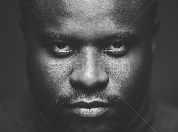Kép rosszakaratú fickó néz kamera szem Stock fotó © pressmaster
